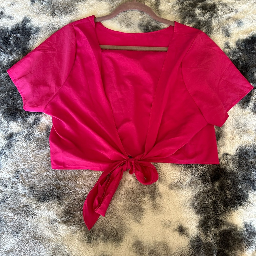 Pink open back crop top.